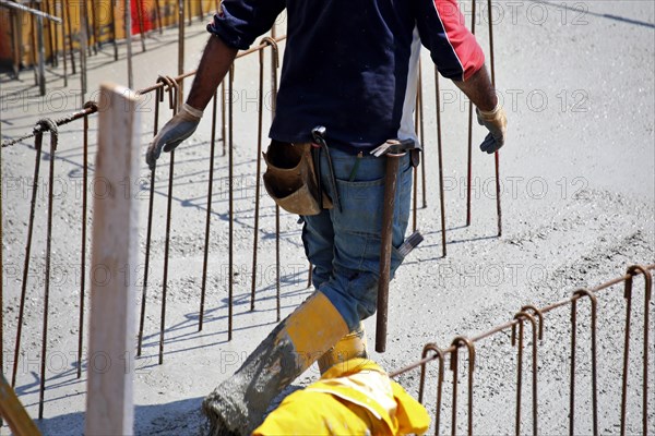 Concreting a floor slab with ready-mixed concrete on the construction site of a residential building