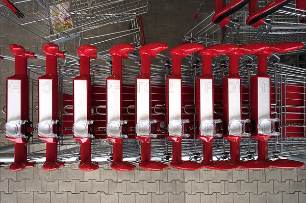 Shopping trolley with magnifying glass in front of a supermarket, Bavaria, Germany, Europe