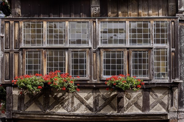 House facade with window, half-timbered house in the old town of Dinan, Brittany, France, Europe