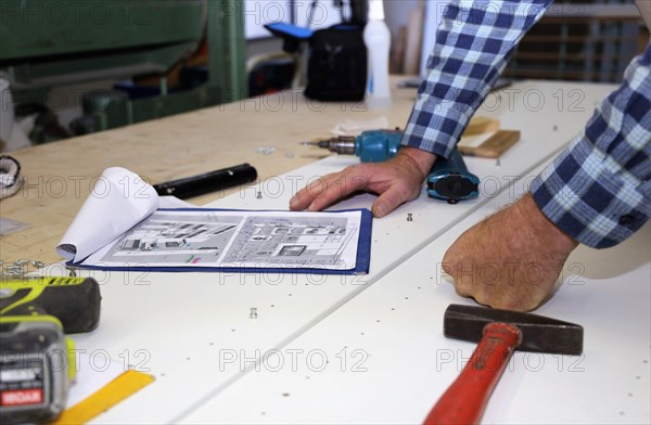 Carpenter at work in his carpentry workshop