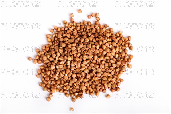 Pile of buckwheat isolated on white background. Top view