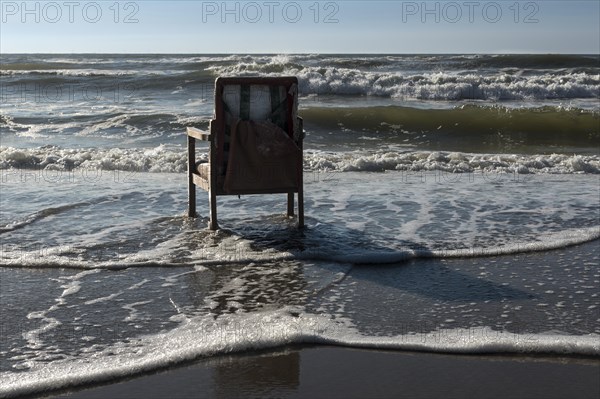 Upholstered chair washed up on the North Sea shore, flotsam, Oksbol, Region Syddanmark, Denmark, Europe