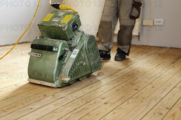 A parquet floor is sanded and oiled