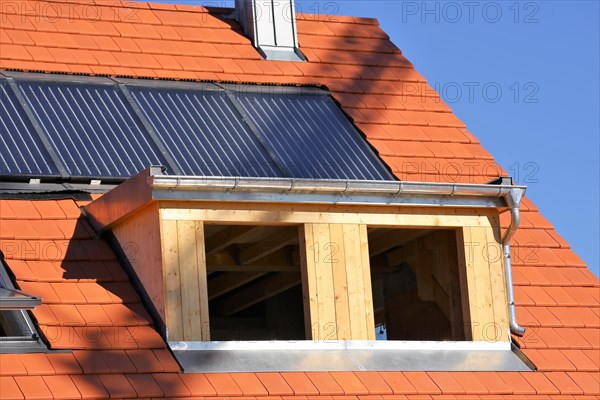 Roofer working on a new dormer window