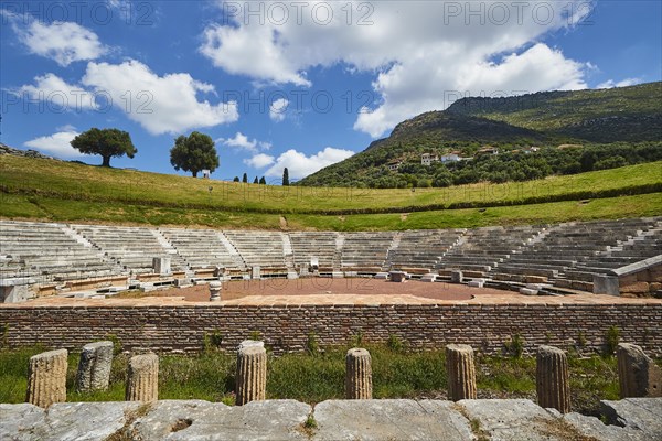 Ancient theatre with semi-circular rows of seats and stage, surrounded by nature, Ancient theatre, Archaeological site, Ancient Messene, Capital of Messinia, Messini, Peloponnese, Greece, Europe