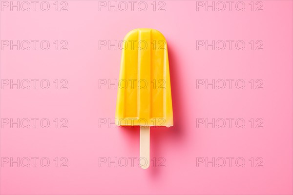 Yellow ice popsicle on pink background. KI generiert, generiert AI generated