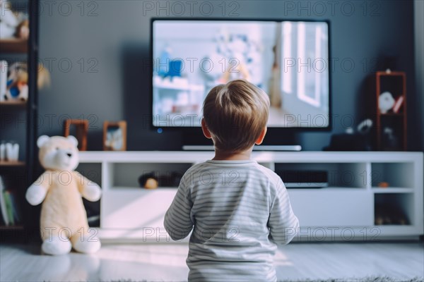 Back view of young boy child watching TV. KI generiert, generiert AI generated