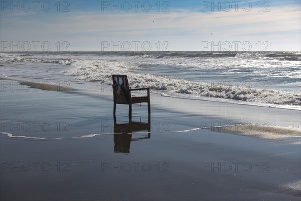 Upholstered chair washed up on the North Sea shore, flotsam, Oksbol, Region Syddanmark, Denmark, Europe