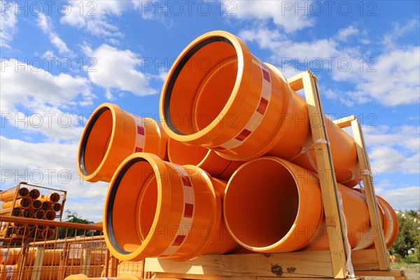 Stack of KG pipes on a construction site in the Mutterstadt development area, Rhineland-Palatinate