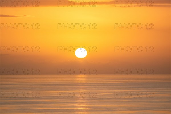 Sunset over the sea at Grande Anse Beach, Basse Terre, Guadeloupe, the French Antilles and the Caribbean, North America