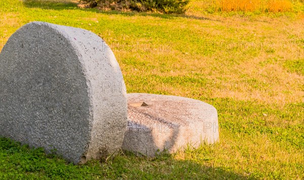 Giant millstone in lawn in South Korea