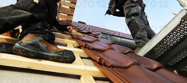 Panoramic image of the roof covering of a new tiled roof on a residential building