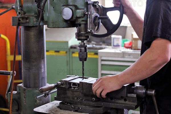 Labourer in the locksmith's shop