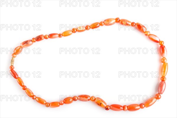 Colored onyx beads isolated on white background. top view, close up