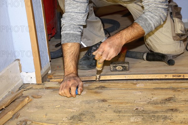 A parquet floor is sanded and oiled