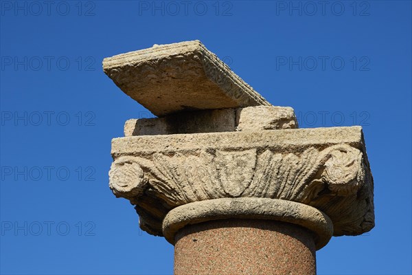 Close-up of an ancient column capital with detailed relief against a clear sky, sea fortress Methoni, Peloponnese, Greece, Europe
