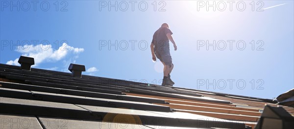 Panoramic image of the roof covering of a new tiled roof on a residential building