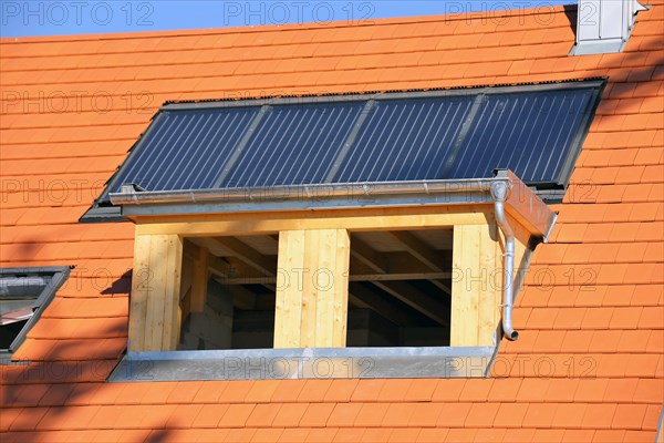 Roofer working on a new dormer window