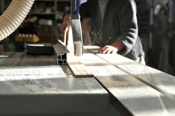 Carpenter at work in his carpentry workshop