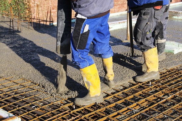 Concreting a floor slab with ready-mixed concrete on the construction site of a residential building