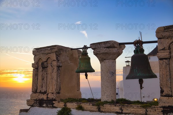 Bell tower at sunset, Oia, Santorini, Cyclades, Greece, Europe