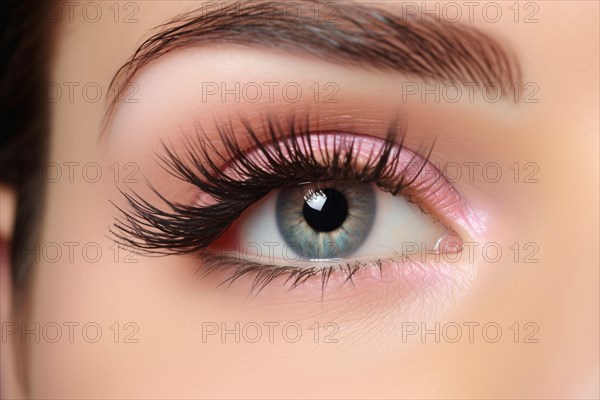 Close up of woman's eye with long black fake lashes and beautiful pink eyeshadow makeup. KI generiert, generiert AI generated