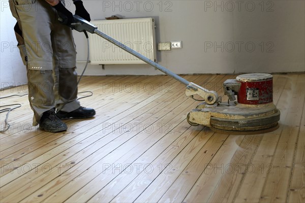 A parquet floor is sanded and oiled