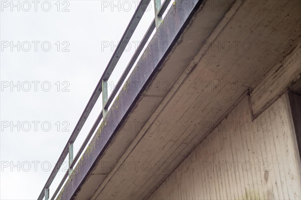 Concrete bridge with railing from below