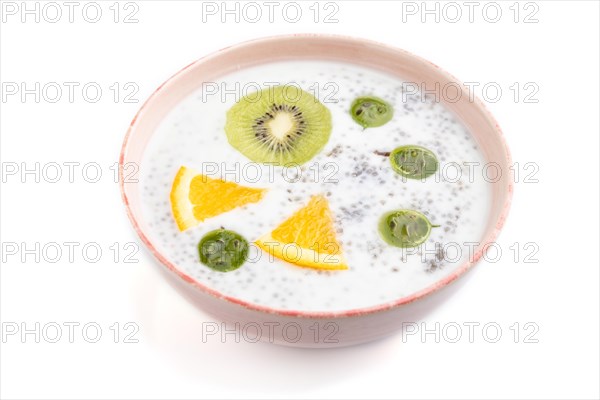 Yogurt with kiwi, gooseberry, chia in ceramic bowl isolated on white background. Side view, close up