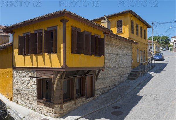 Two-storey traditional house with yellow facade and open shutters, Soufli, Eastern Macedonia and Thrace, Greece, Europe