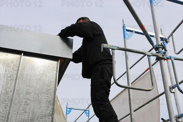 Roofer working on a new dormer window