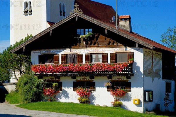 Old traditional farmhouse with many flower boxes near Bad Toelz, Bavaria, Germany, Europe