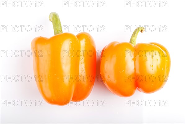 Two yellow sweet peppers isolated on white background. closeup