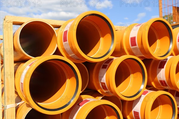 Stack of KG pipes on a construction site in the Mutterstadt development area, Rhineland-Palatinate