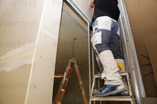 Craftsmen doing drywall work