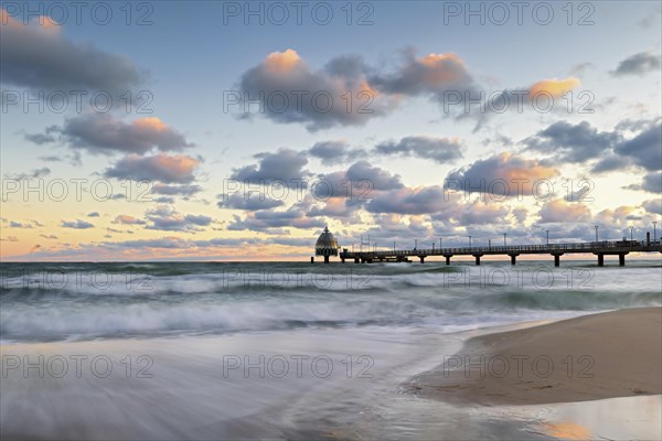 Sunrise at the pier of zingst during an icy storm as a long exposure