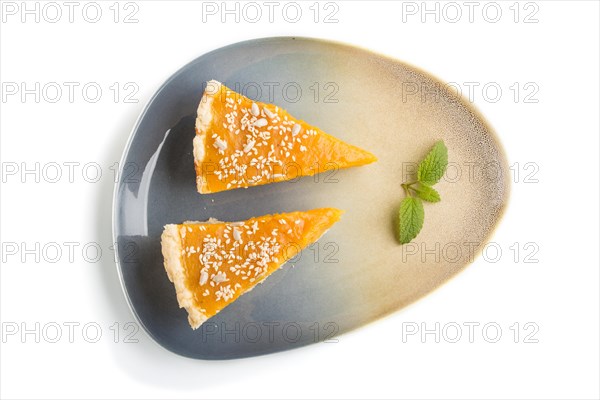 Two pieces of traditional american pumpkin pie isolated on white background. top view, flat lay