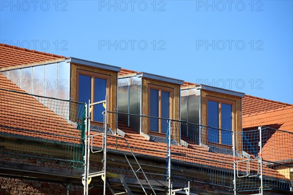 Roofer working on a new dormer window