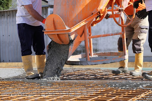 Concreting a floor slab with ready-mixed concrete on the construction site of a residential building