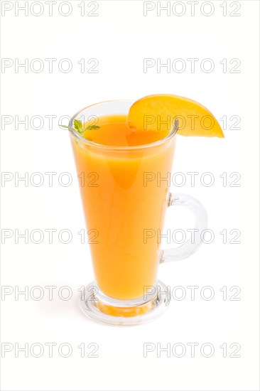 Glass of peach juice isolated on white background. Morninig, spring, healthy drink concept. Side view, close up