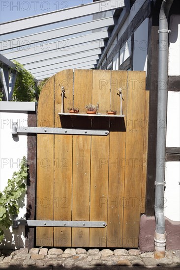 Old brown wooden gate at a garden, Hoya, Lower Saxony, Germany, Europe