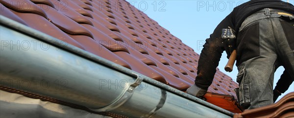 Panoramic image of the roof covering of a new tiled roof on a residential building