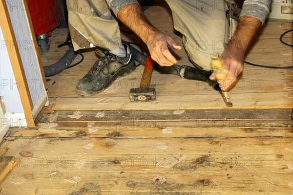 A parquet floor is sanded and oiled