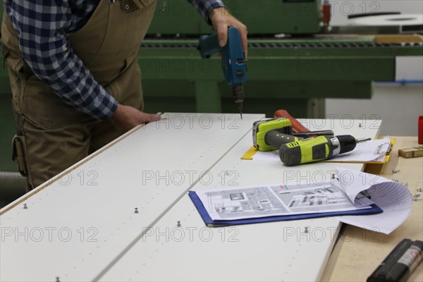 Carpenter at work in his carpentry workshop