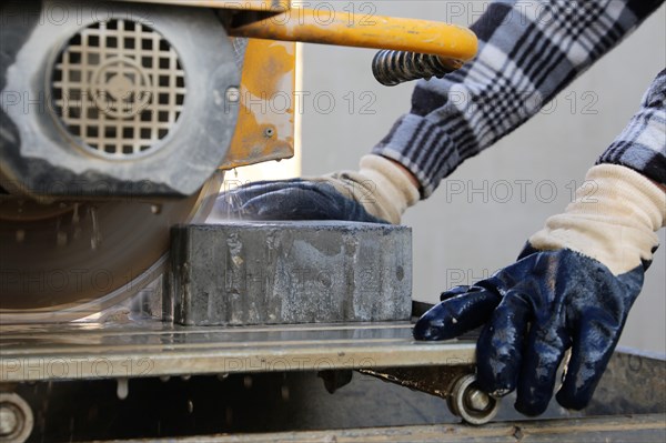 Bricklayer at the stone cutter