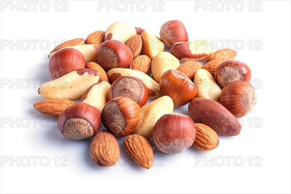 Piles of various nuts isolated on white background. hazelnut, brazil nut, almond, pumpkin seeds, cashew. close up