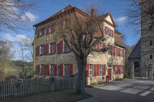 Historic vicarage of St Egidienkirche from 1734, in front of it a trimmed summer lime tree (Tilia platyphyllos), Beerbach, Middle Franconia, Bavaria, Germany, Europe