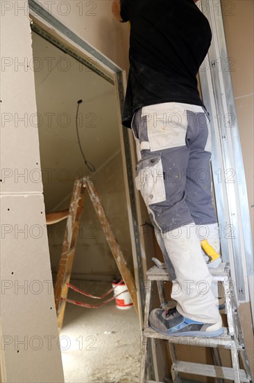 Craftsmen doing drywall work