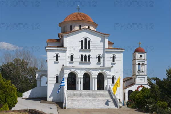 A whitewashed church with a red roof and a dome under a clear blue sky, Greek Orthodox Church of the Transfiguration of the Saviour, Porto Lagos, Xanthi, Eastern Macedonia and Thrace, Greece, Europe