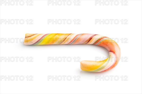 Single christmas cane candies isolated on white background. close up, side view